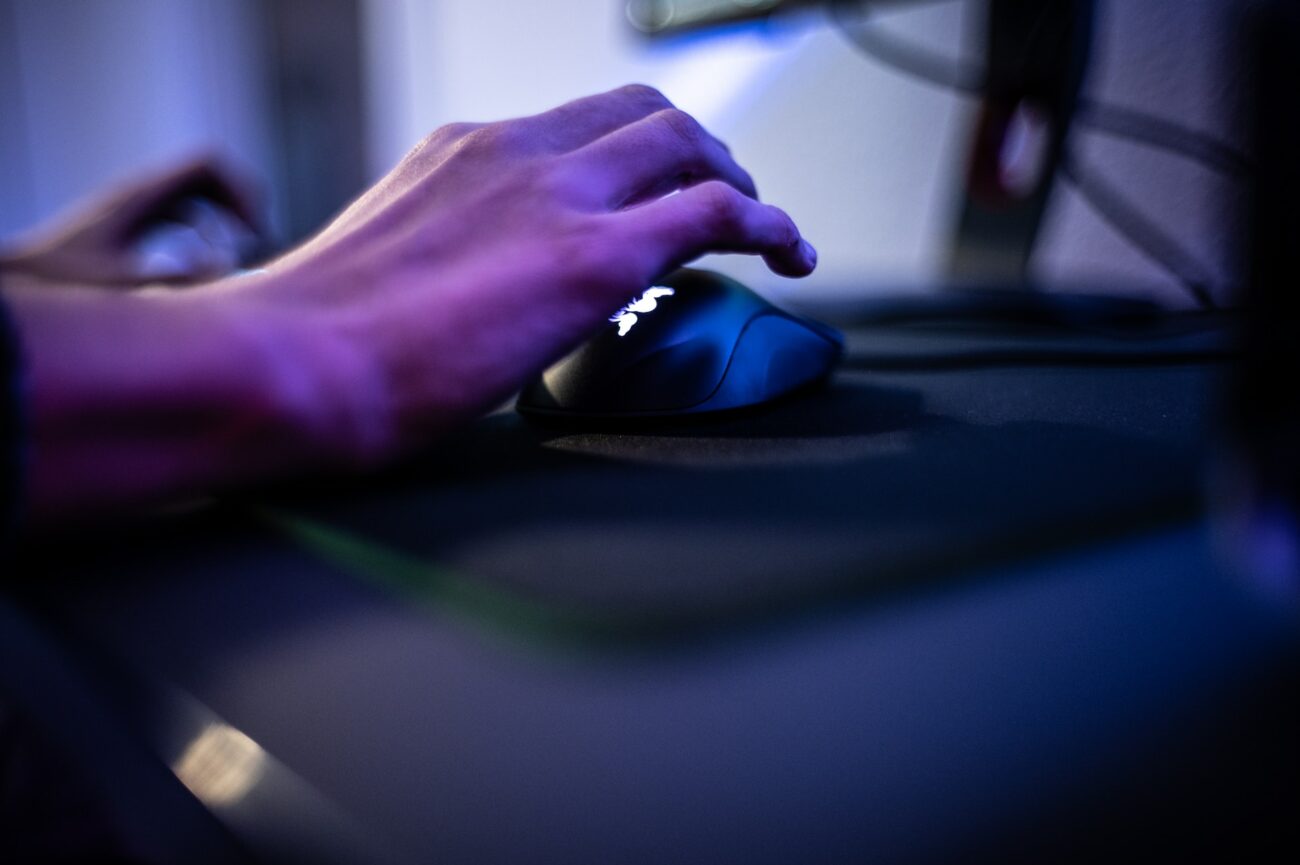 man holding his hand on the mouse